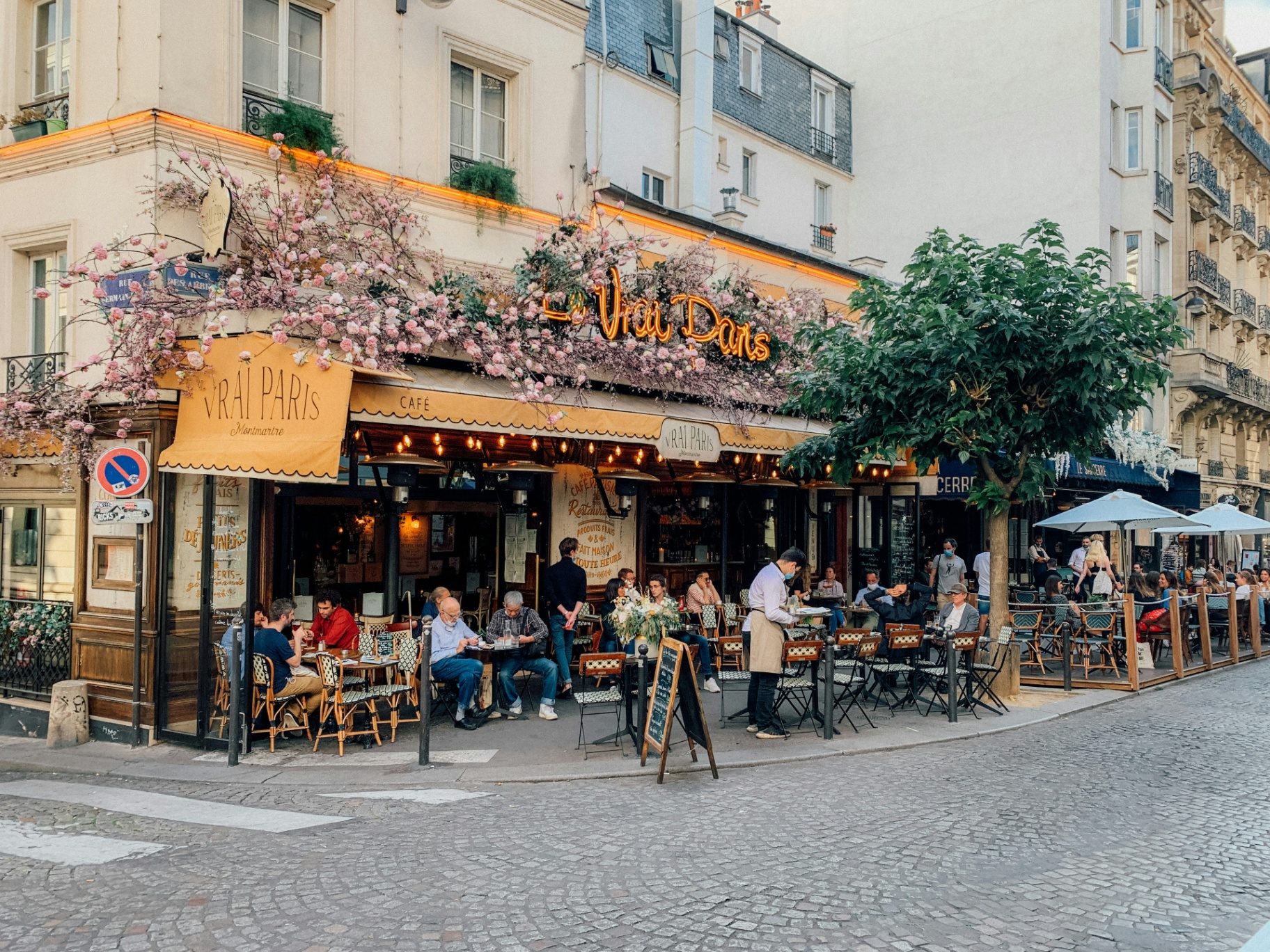Outdoor cafe terrace on a quiet village square with stone buildings